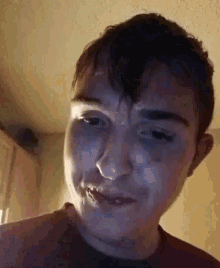 a close up of a person 's face with a blurred background .