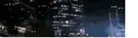 a blurry picture of a city at night with a white background