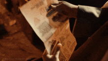 a person holding a piece of paper that says p3ns1v3.tumblr.com on it
