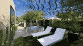 an artist 's impression of a backyard with a hot tub and two lounge chairs