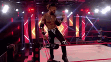 a man in a wrestling ring with the number 21 on his shorts