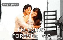 a man and a woman are hugging each other and a man is saying `` i 'm yours forever too '' .