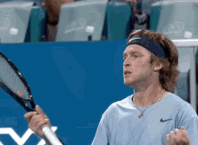 Andrey Rublev Bite Racquet GIF