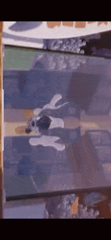 a close up of a glass table with a painting on it .