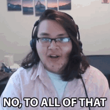 a man wearing headphones and glasses is saying no to all of that .