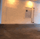 a white wall with a door that says emergency exit