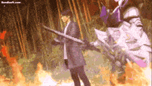 a man is holding a sword in front of a fire with the website bandisoft.com visible