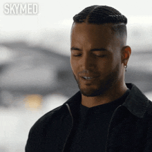a close up of a man with the words skymed behind him
