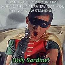 robin is holding a gun in his hand and saying `` holy sardine '' .