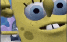 a close up of a cartoon character , spongebob squarepants , with big blue eyes and teeth .