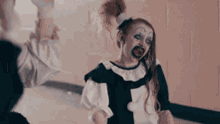 Pale Girl And Art The Clown Laughing Terrifer GIF