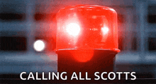 a red light with the words " calling all scotts " above it