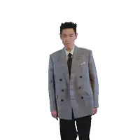 a man in a suit and tie is dancing in front of a white background