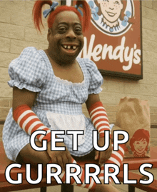 a wendy 's sign is behind a woman in a dress