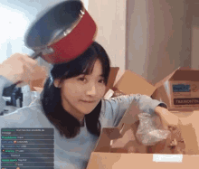 a woman holding a pot on her head next to a box that says tramontina