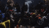a group of cartoon characters are gathered around a table with a cannon that says ' a ' on it