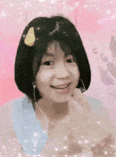 a girl wearing headphones and a yellow sticker on her head