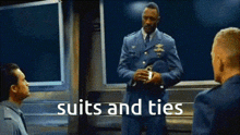 a man in a suit and tie is standing next to another man with the words suits and ties written below him