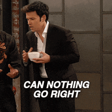 a man in a suit holding a bowl with the words " can nothing go right " above him