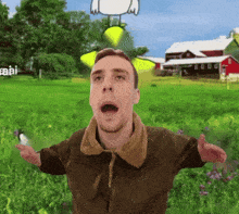 a man in a brown jacket stands in a field with his arms outstretched in front of a cartoon chicken