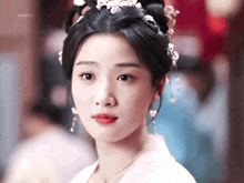 a close up of a woman 's face with a gif watermark