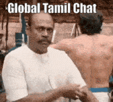 a man in a white shirt is talking to another man in a white shirt with the words global tamil chat above him