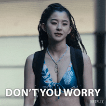 a woman in a bikini says " do n't you worry " on a netflix ad