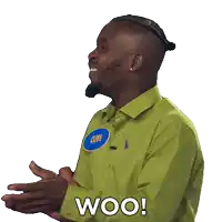 a man wearing a green shirt with the word woo on it