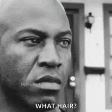 a man is standing in front of a house and asking what hair .