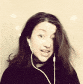 a woman wearing a choker and ear buds looks at the camera