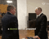 a decree will be prepared is displayed on a screen between two men