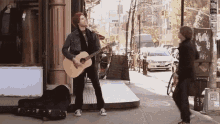 playing guitar street performer rude musician moves music video