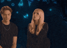 a man and a woman standing next to each other with a blue outline of a man in the middle