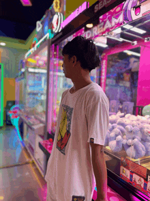 a man in a white shirt stands in front of a dream machine