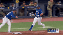a blue jays player runs to first base during a game