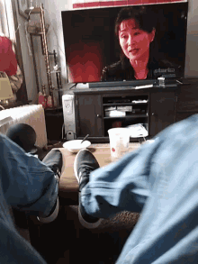 a person is sitting in front of a tv that says star 40 on it