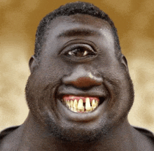 a close up of a man 's face with a large smile