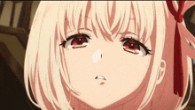 a close up of a girl 's face with red eyes and white hair