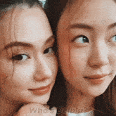 a close up of two women with the words who 's delulu on the bottom right