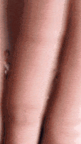 a close up of a woman 's arm with a ring on it .