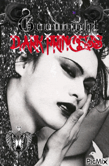 a black and white photo of a woman with the words goodnight dark princess written in red