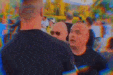 a blurry picture of a crowd of people walking down the street .