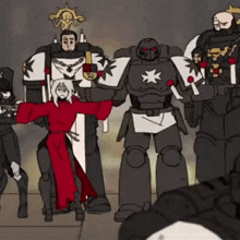 a group of robots are standing next to each other in a room .