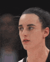 a close up of a woman 's face with a headband