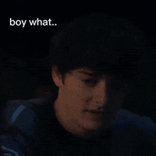 a close up of a man 's face with the words boy what written on the bottom