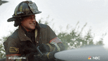 Extinguishing Fire Kelly Severide GIF - Extinguishing Fire Kelly Severide Taylor Kinney GIFs
