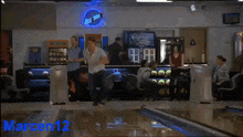 a bowling alley with the number 13 and 14 on it