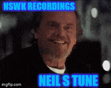 a man with a beard is smiling with nswk recordings neil 's tune written above him