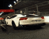 a white sports car with a license plate that says ' lc ' on it