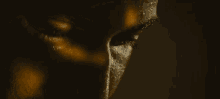 a close up of a person 's face with sweat on it